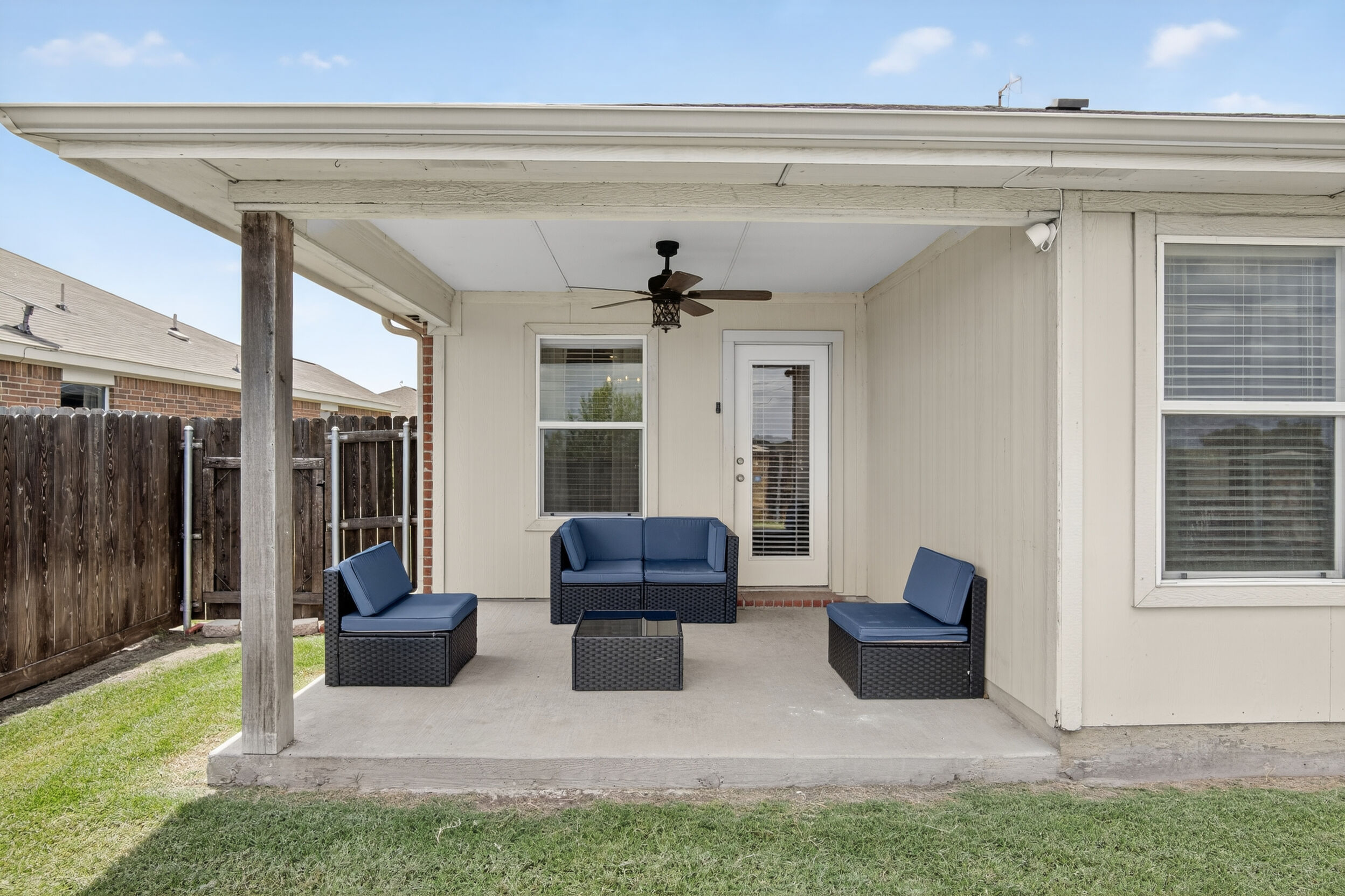 Covered back patio with outdoor seating