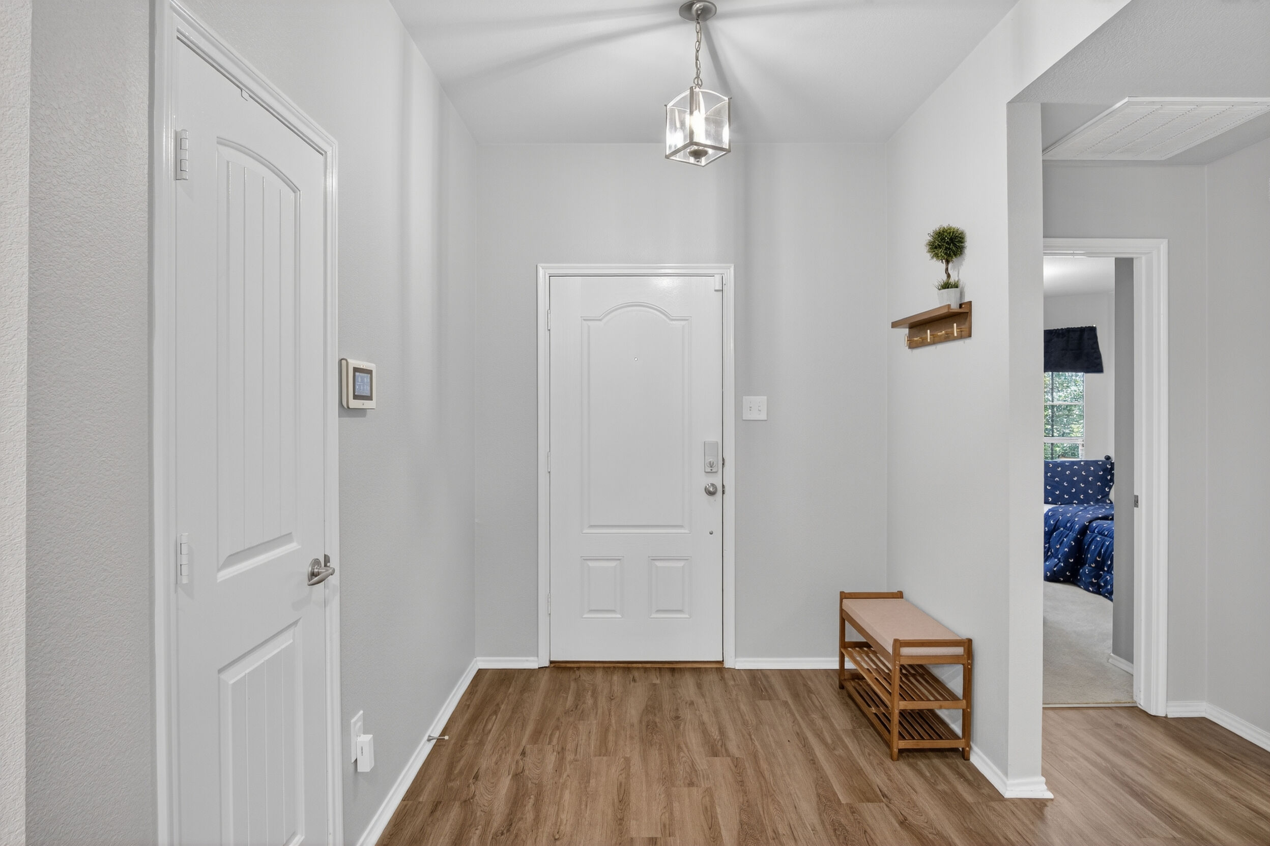 Entryway foyer with hallway to bedrooms