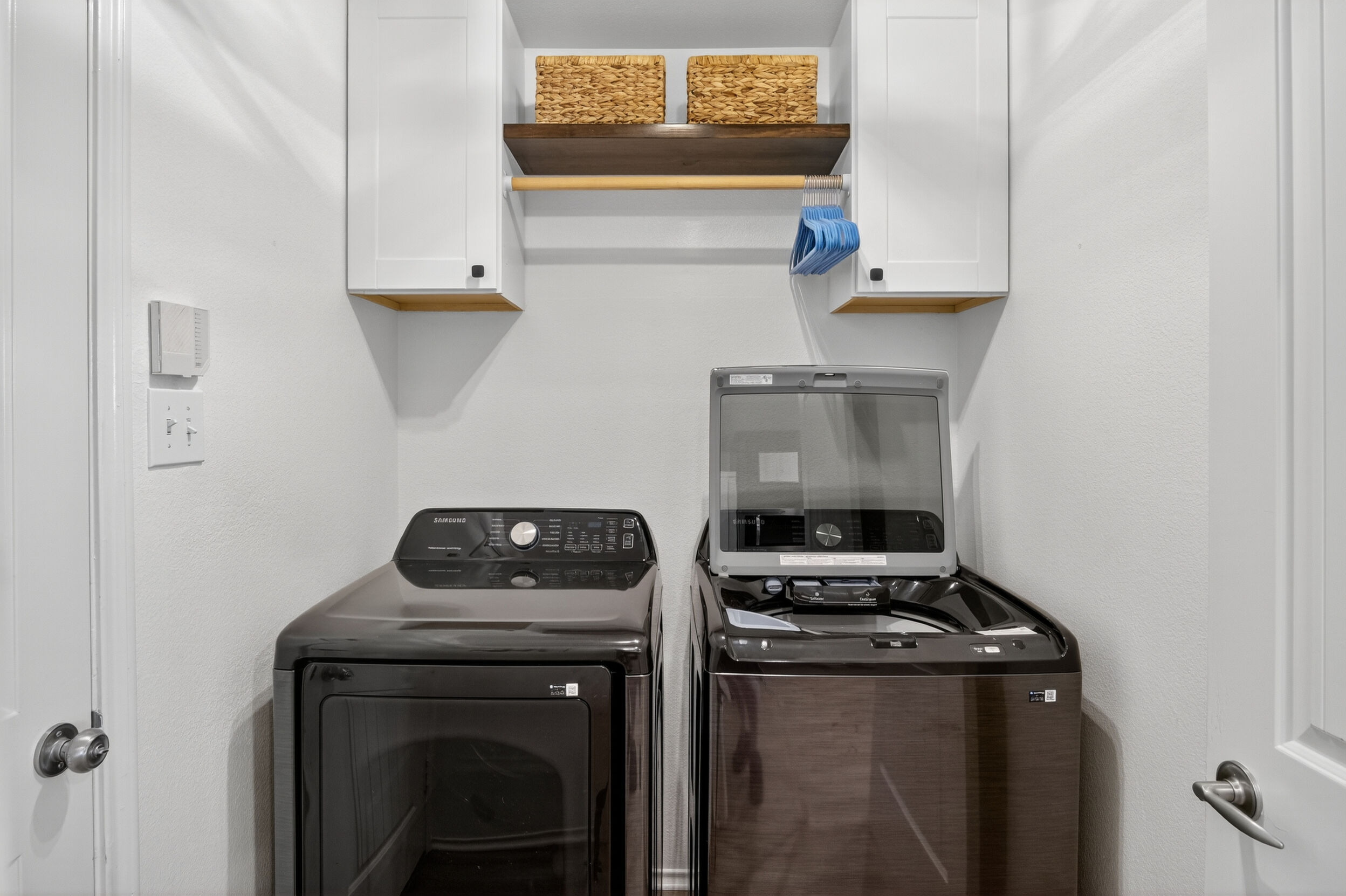 Laundry room with full-size washer and dryer