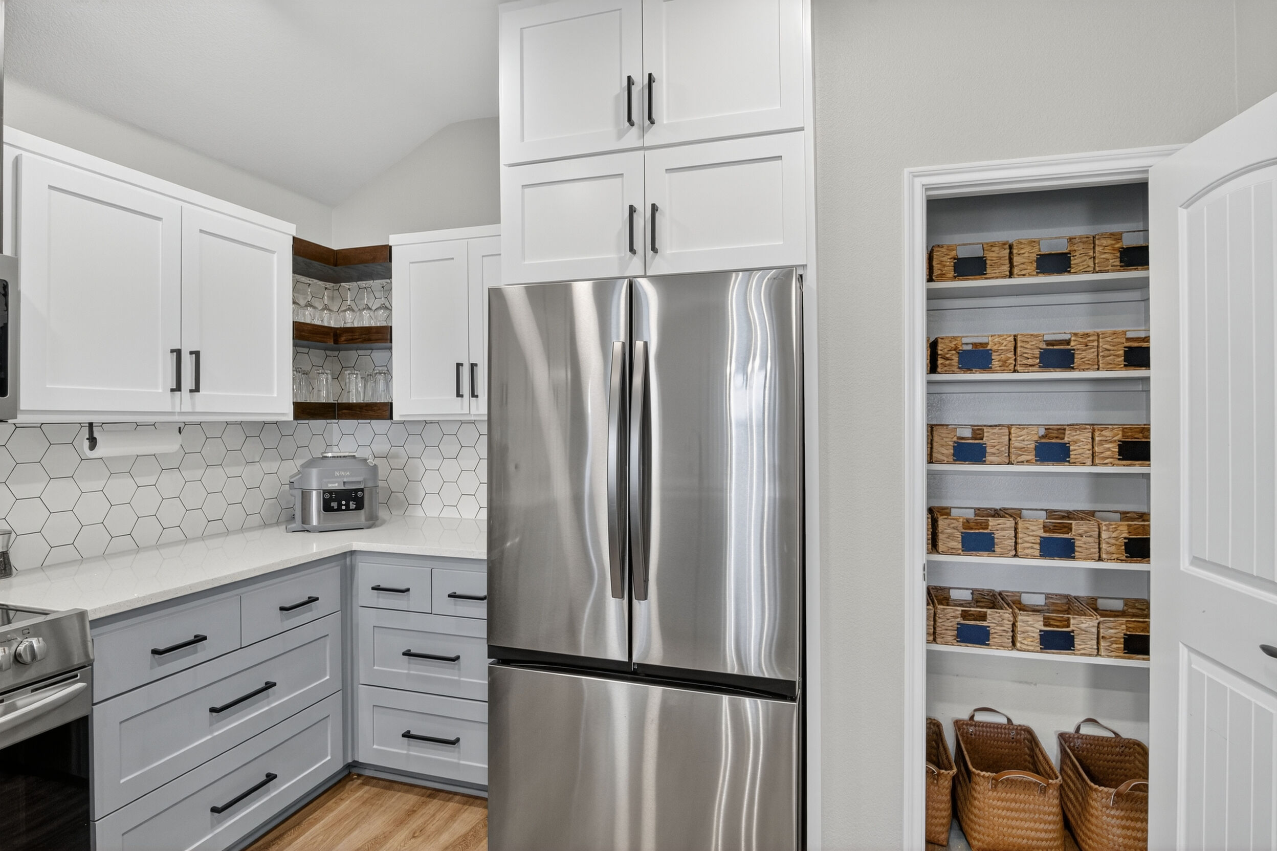 Kitchen with stocked pantry shelving