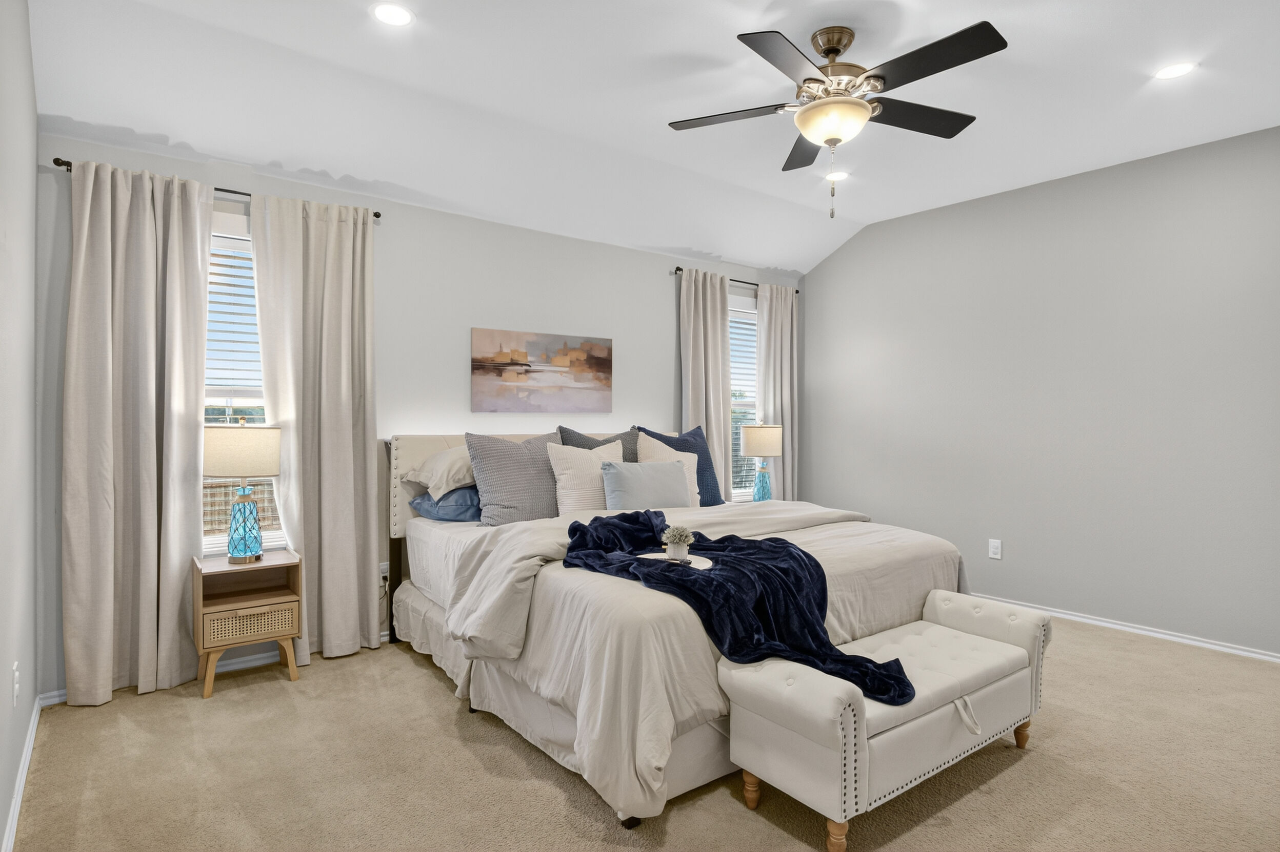 Primary bedroom seating and natural light