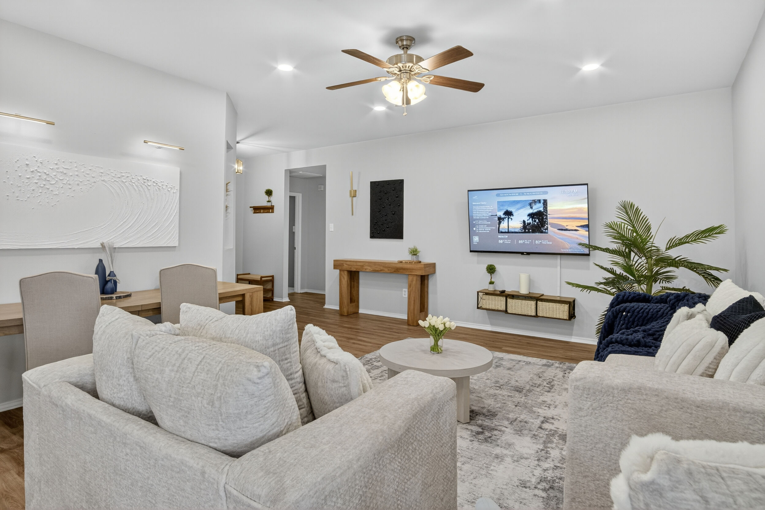 Living room with sofas and mounted TV