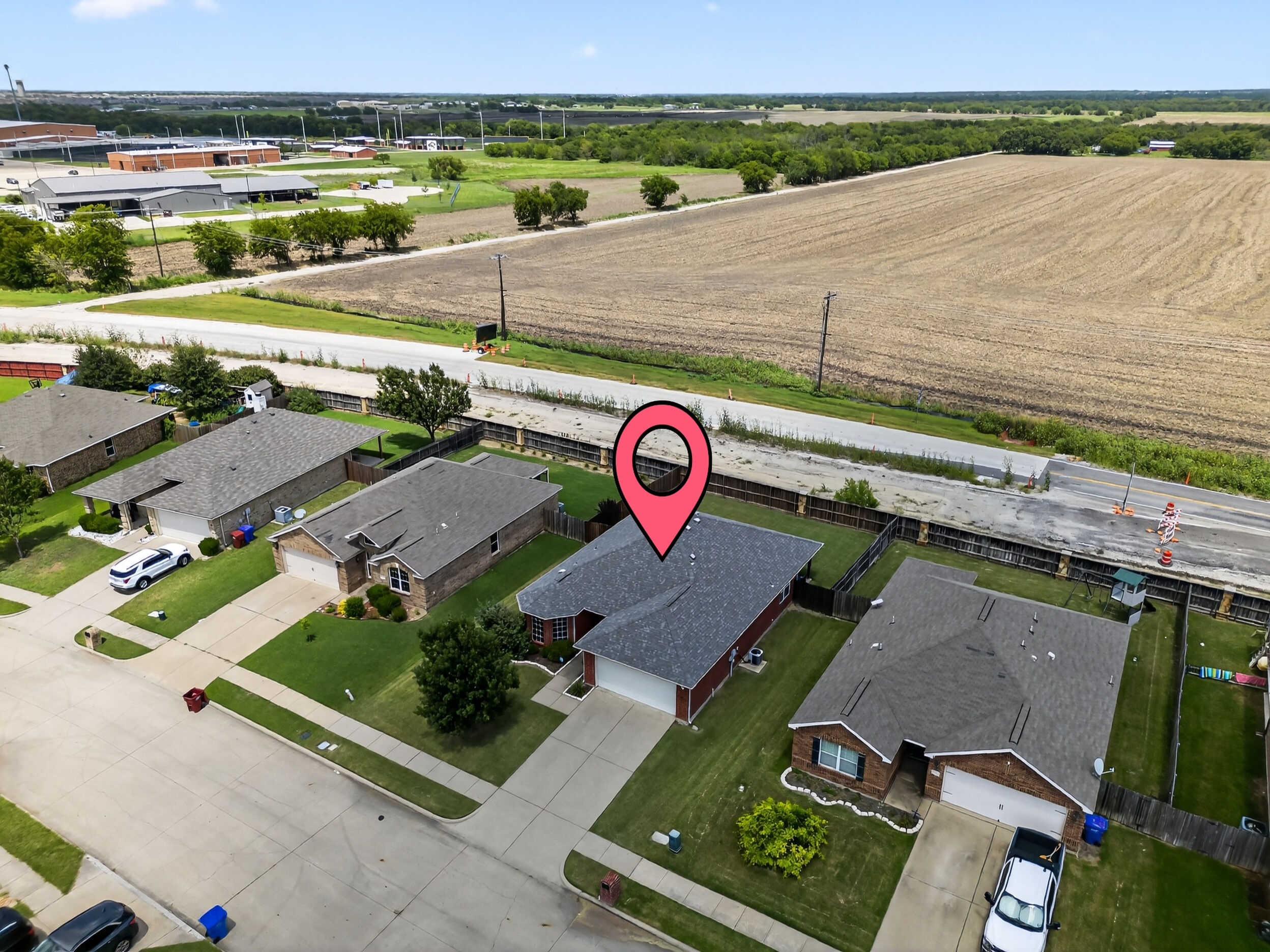 Aerial view of the property and nearby fields