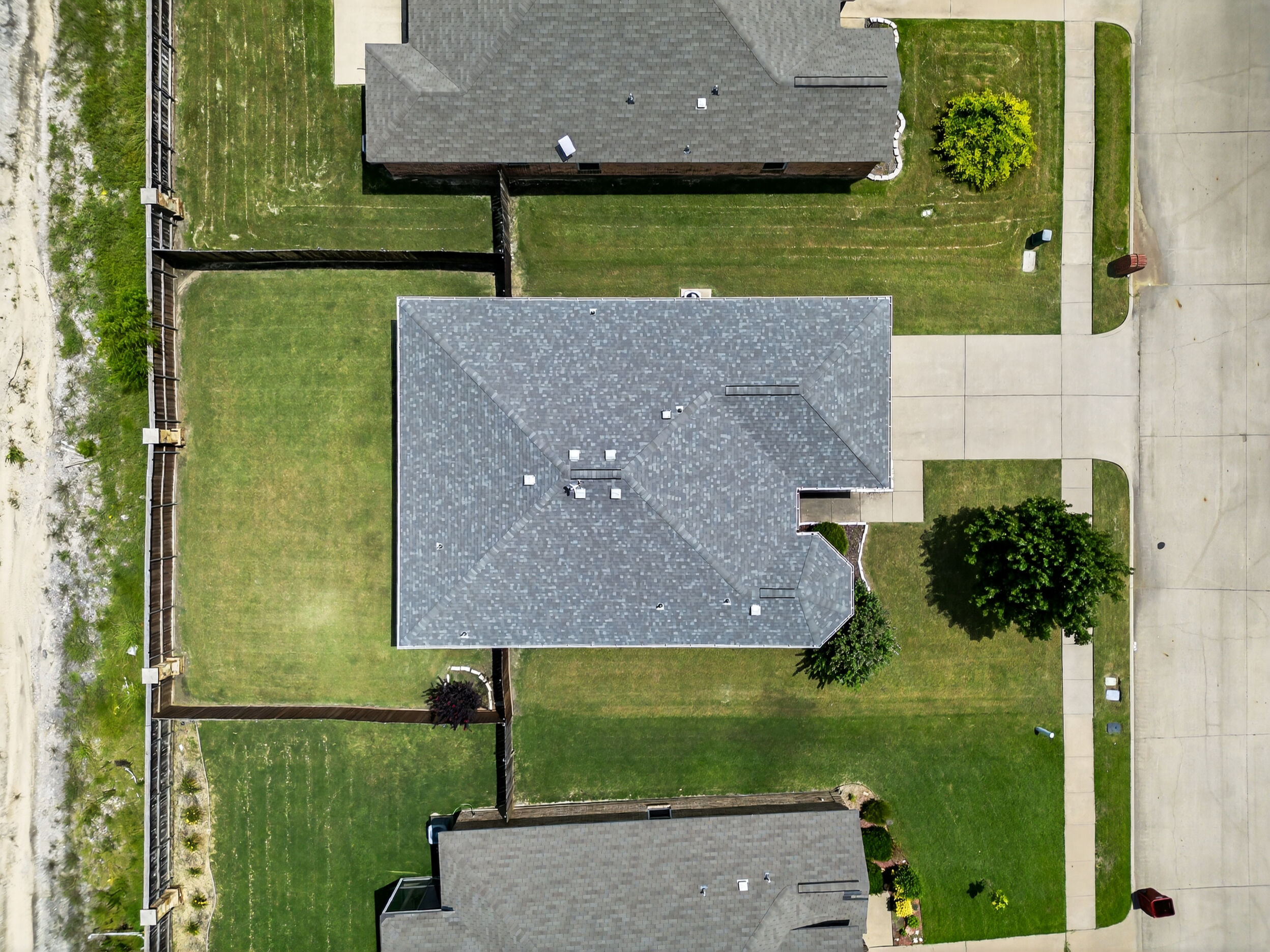 Top-down aerial of the home and backyard