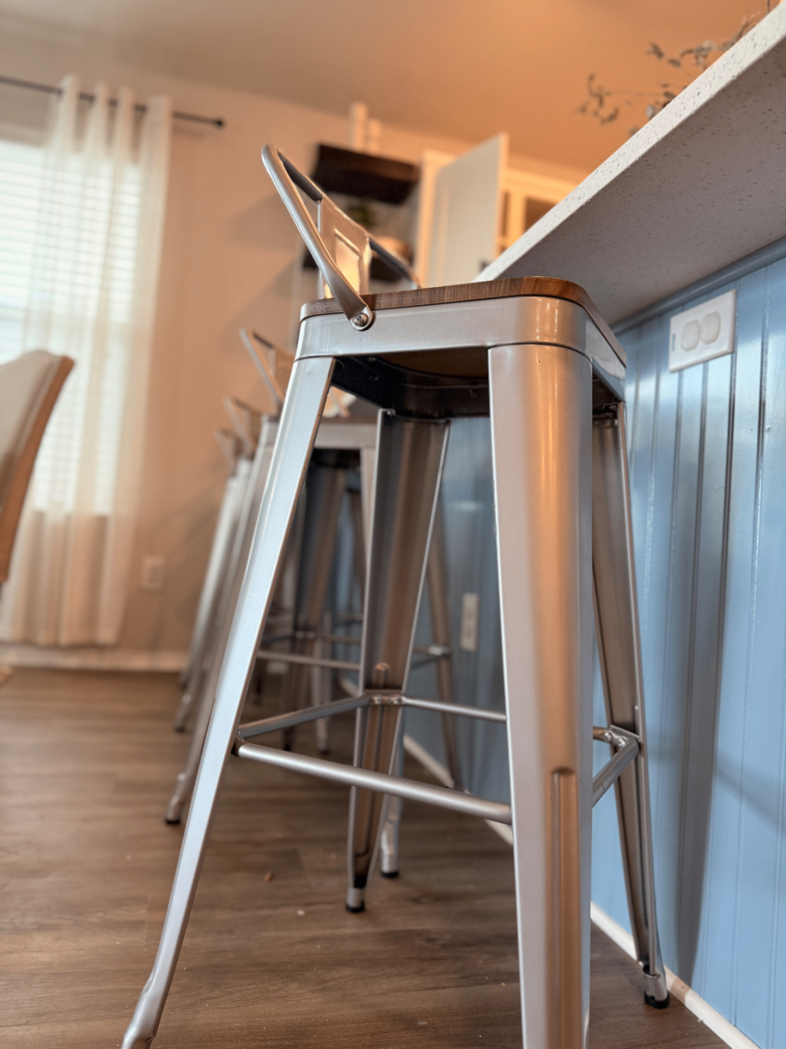 Metal bar stools at the kitchen counter