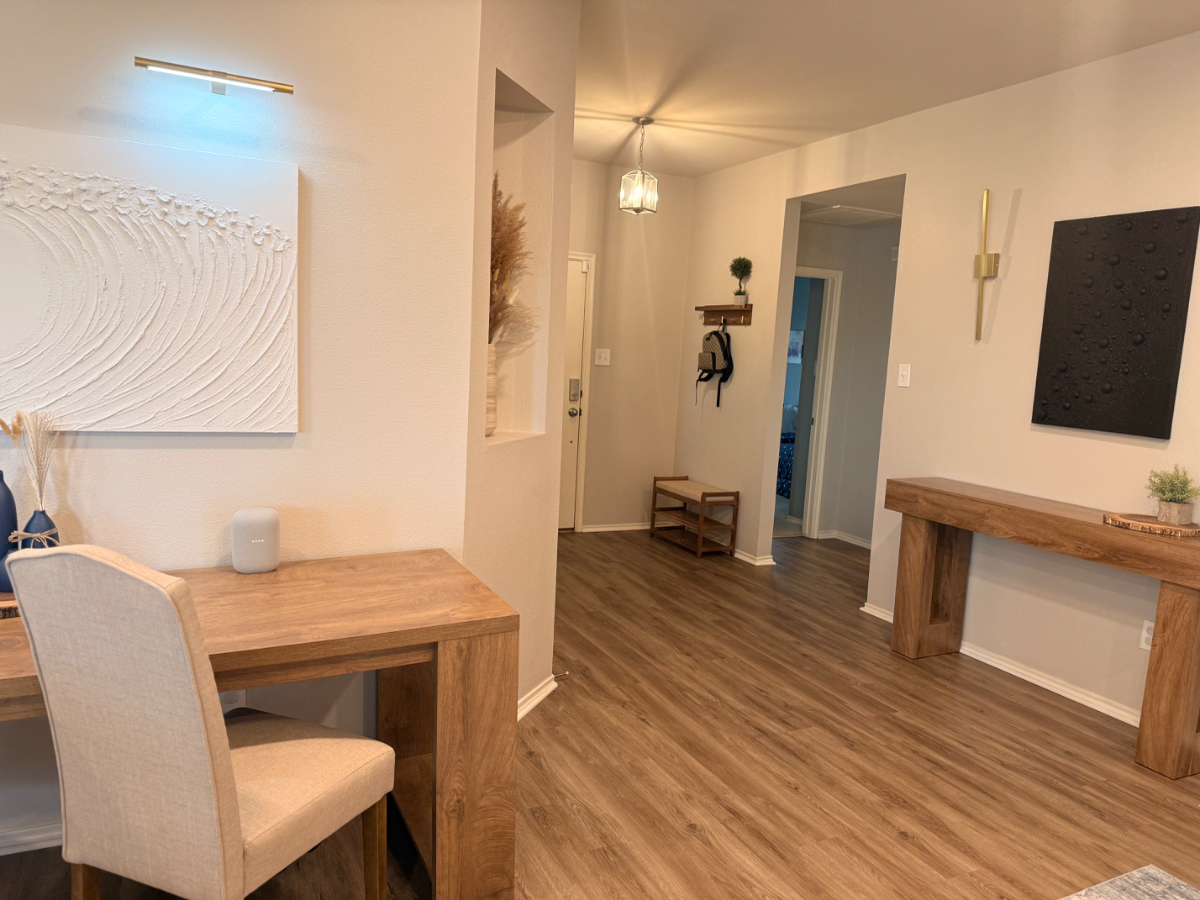 Foyer with desk workspace, console table and hallway